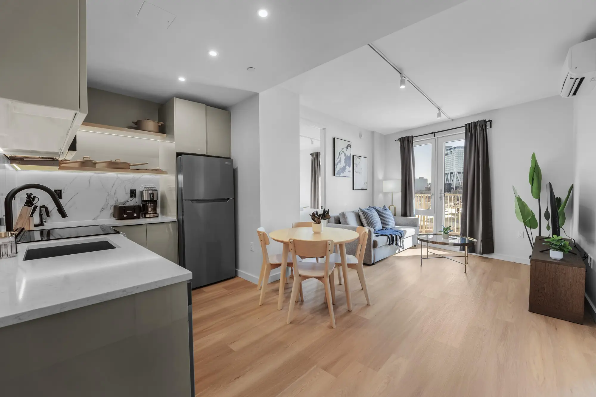Open kitchen, dining, and living space in a Waypost Brooklyn residence