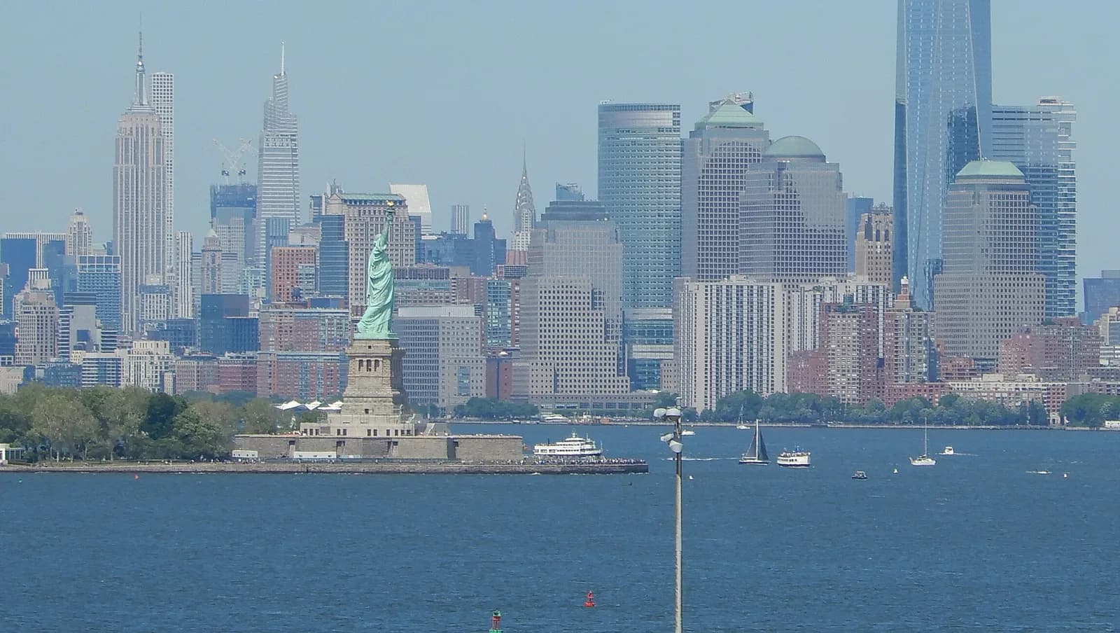 The Statue of Liberty with Lower Manhattan behind it